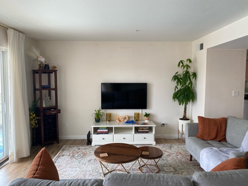 White TV Stand Styling with Nested Coffee Tables & Burnt Orange