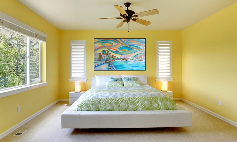 White Upholstered Platform Bed with Plantation Shutters