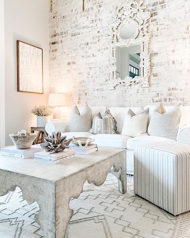 Whitewashed Brick Accent Wall Ideas with Scalloped Coffee Table