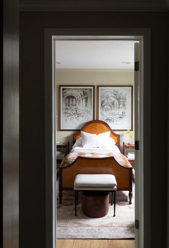 Wood Framed Bed with Curved Headboard and Architectural Wall Art