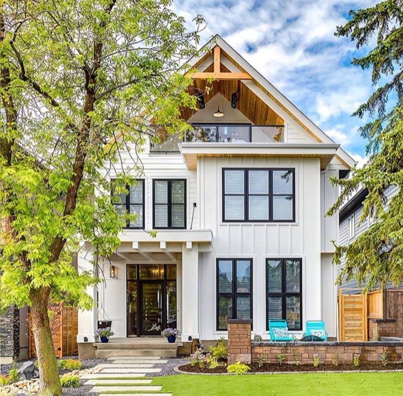 Wood Gable Porch Ceiling and Timber Detail on White Farmhouse
