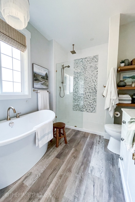 Wood-Look Bathroom Flooring Ideas: Freestanding Tub and Herringbone Accent