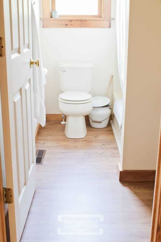 Wood-Look Vinyl Plank Flooring Bathroom with Natural Wood Trim Accents