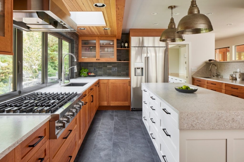 Wood Paneled Ceiling with Skylight in Contemporary Two-Tone Kitchen