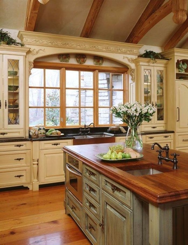Wood Topped Kitchen Island with Sink and Exposed Ceiling Beams