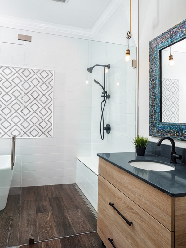 Wood Vanity with Geometric Tile Accent and Dark Wood Look Floor