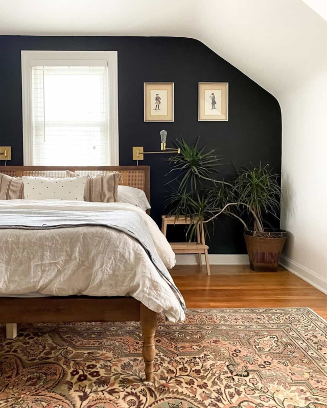 Woven Cane Headboard Bed Moody Bedroom with Brass Sconces