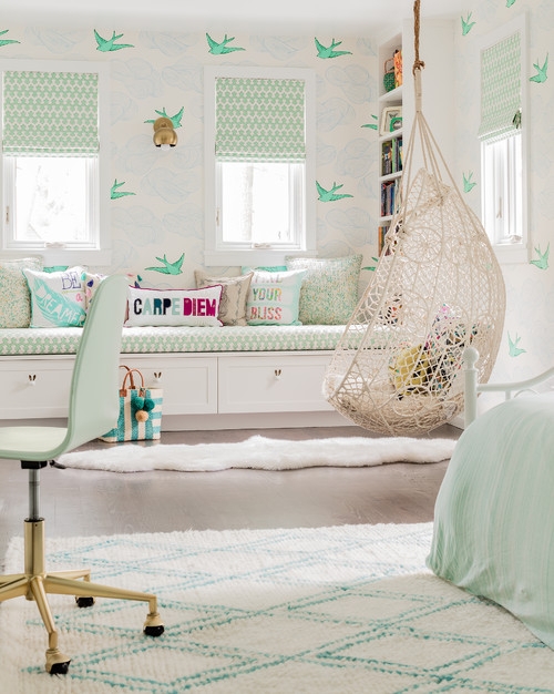 Woven Hanging Chair in Mint Bedroom with Bird Pattern Wallpaper