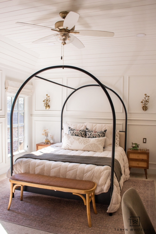 Woven Top Wood Bench at Foot of Arched Canopy Bed
