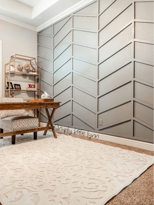 Writing Desk against Grey Chevron Wall Paneling with Gold Etagere