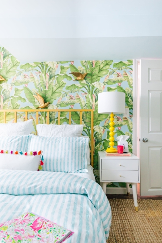 Yellow Metal Spindle Headboard and Striped Duvet in a Coastal Bedroom