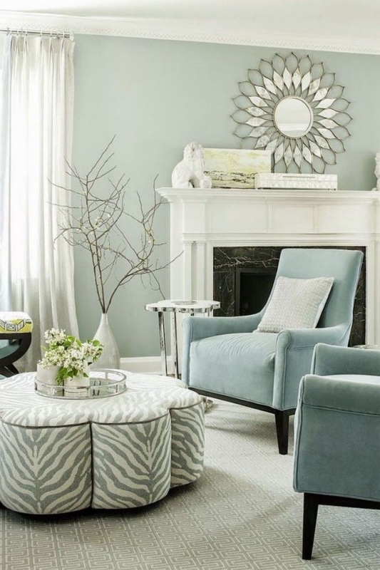 Zebra Print Ottoman and Soft Blue Chairs in Transitional Living Room