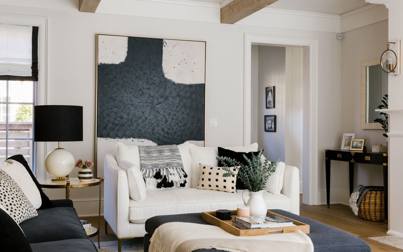 Black and White Transitional Decor under Exposed Wood Ceiling Beams