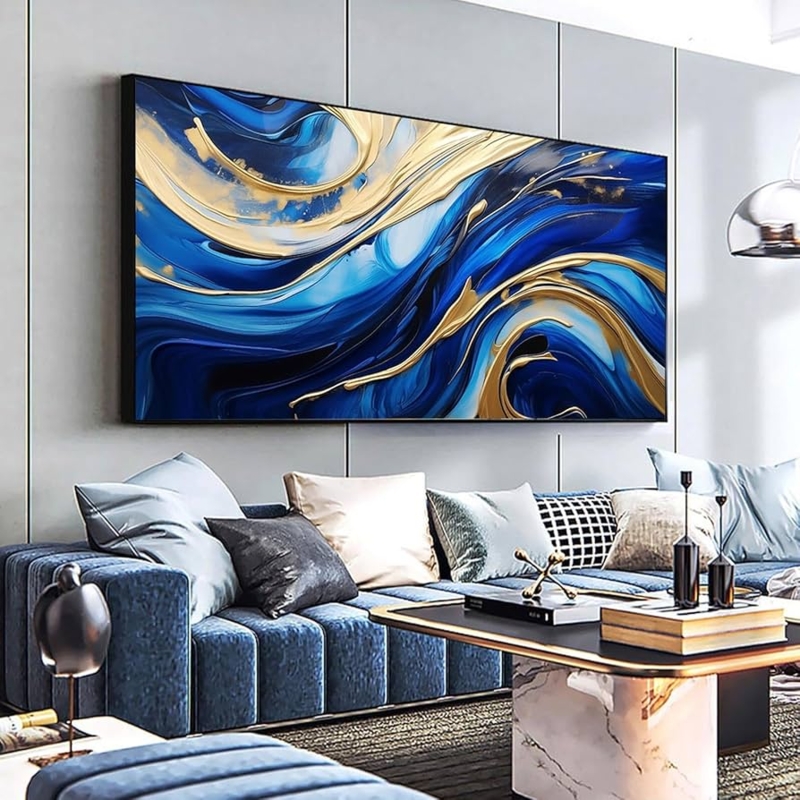 Blue and Gold Abstract Decor above Channeled Upholstery Sofa