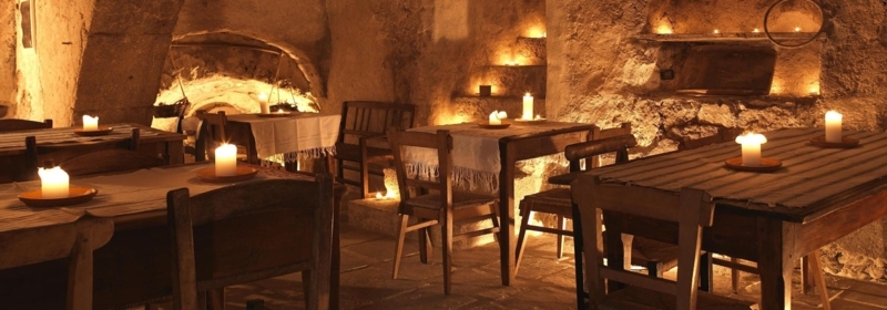 Candlelit Cellar Dining Room with Cavernous Stone Walls