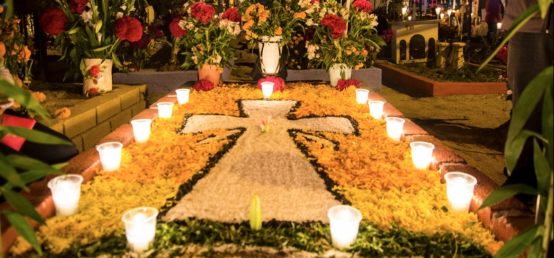 Candlelit Memorial Display with Marigold Petal Cross Motif