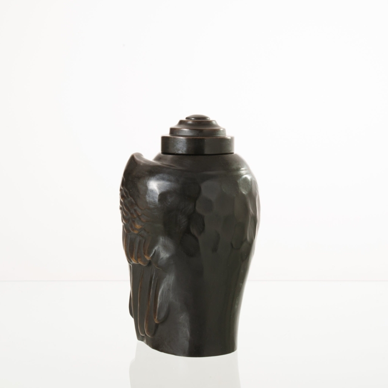 Cast Metal Urn: Dark Patina Finish, Sculptural Wings, Tiered Lid.