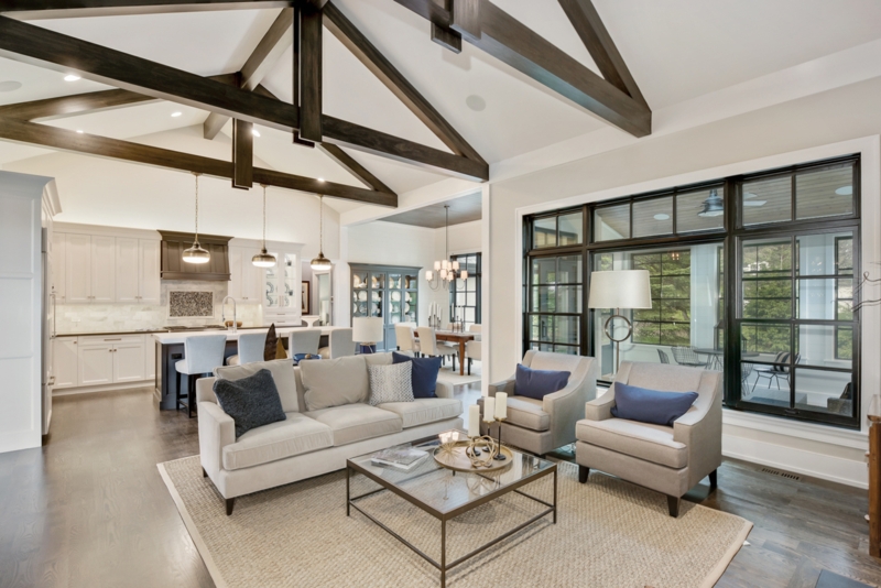 Dark Wood Vaulted Ceiling Beams in an Open Concept Living Room Layout