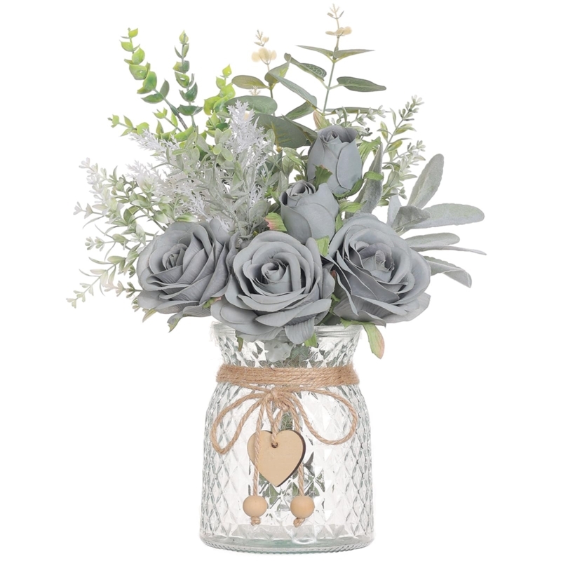 Faux Floral Centerpiece in quilted glass vase with grey blue roses.