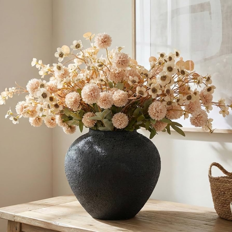 Floral Arrangement in Textured Black Vase with Voluminous Blooms