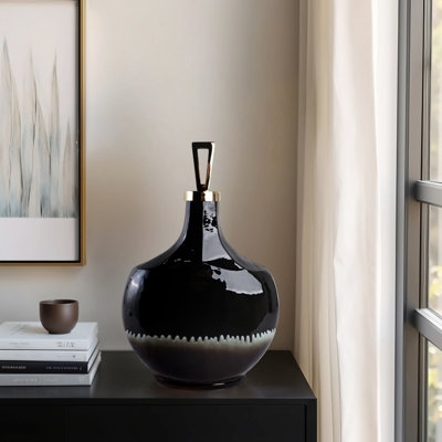 Glossy Black Glass Bottle with Geometric Stopper and Ombré Base.