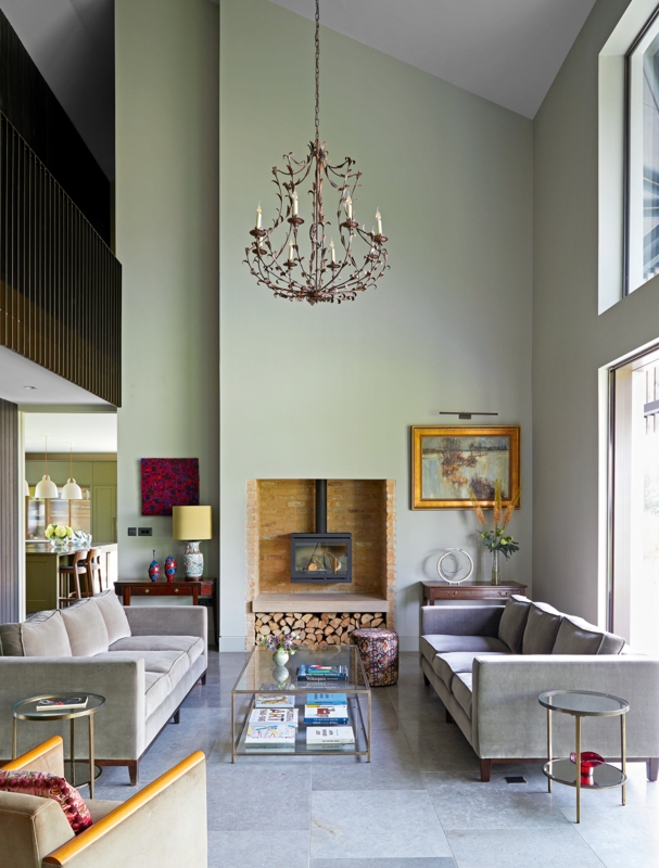 High Ceiling Living Room Decor with Symmetrical Layout and Sage Walls
