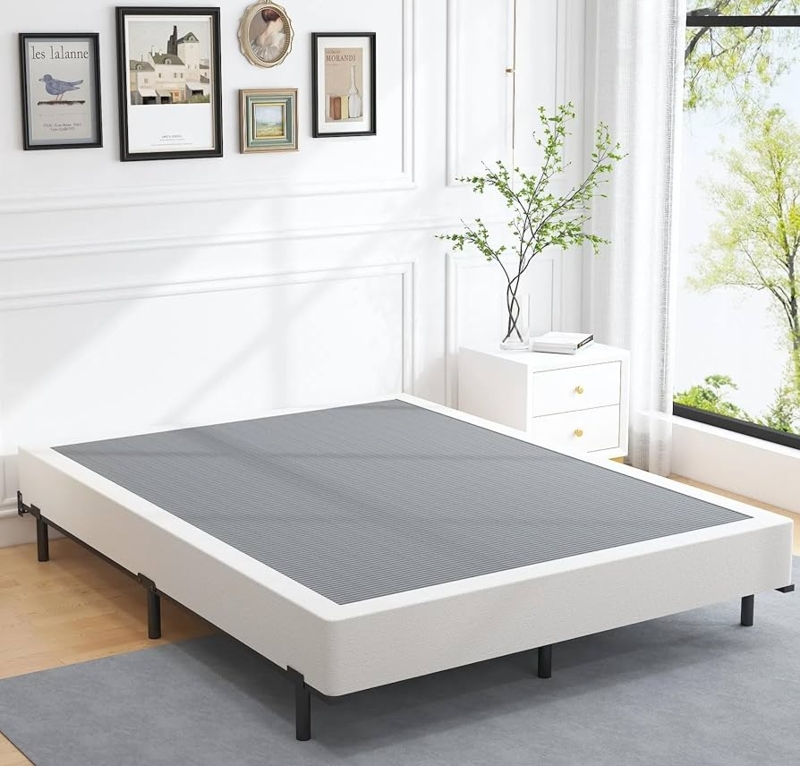 Low-Profile Box Spring, White Upholstered Sides, Charcoal Ribbed Top.