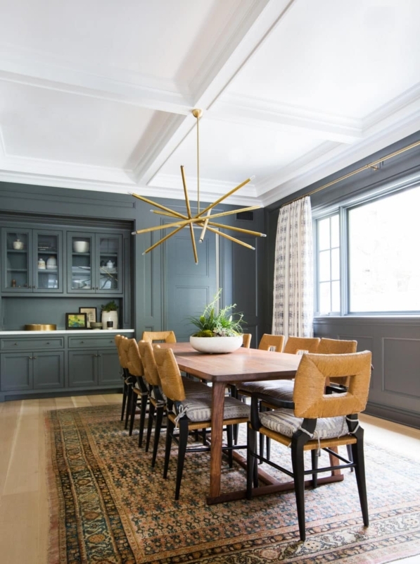Moody Dining Room featuring Teal Walls and Starburst Chandelier