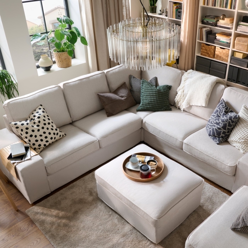 Neutral L-Shaped Sectional Layout with Modern Glass Tube Chandelier