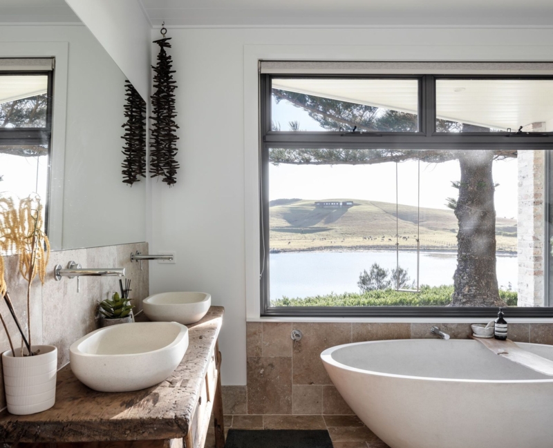 Rustic Reclaimed Wood Vanity with Stone Vessel Sinks and Scenic View