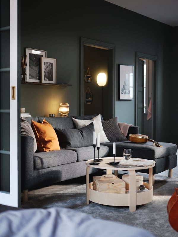 Sectional Sofa in Moody Living Room with Round Wood Coffee Table Storage