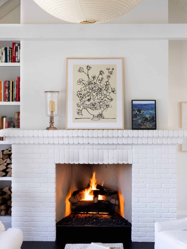 Wall Art: Minimalist Floral Line Art on White Brick Fireplace Mantel.