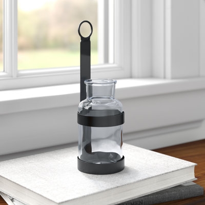 Wall Mounted Vase: Metal Frame with Ring Handle and Glass Bottle.