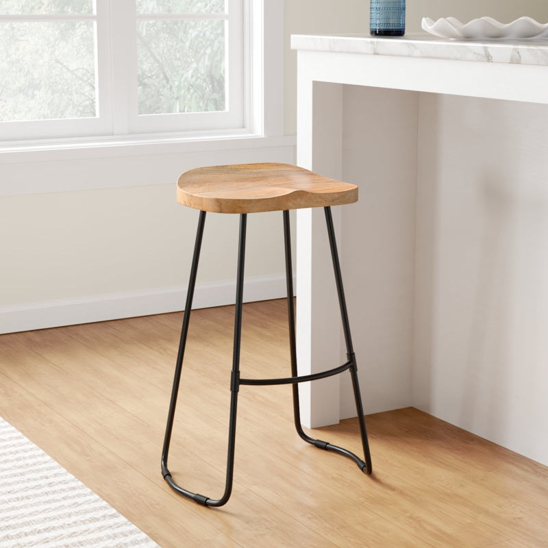Bar Stool Carved Saddle Seat Wood Toned with Slim Black Metal Legs