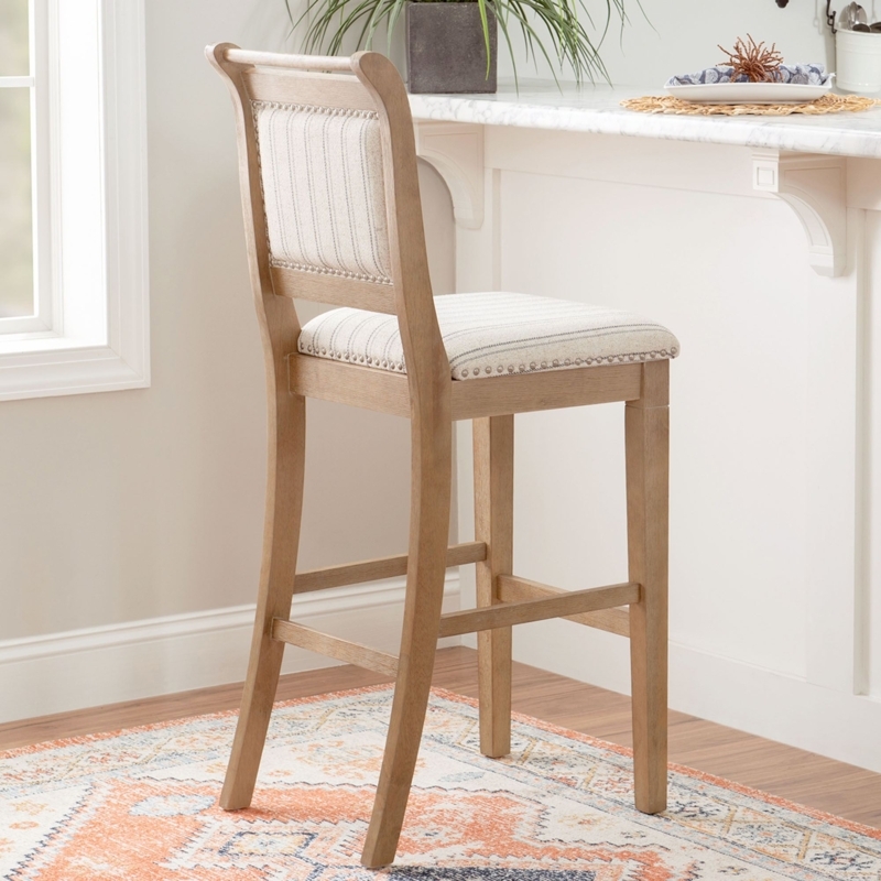 Bar Stool: Pinstripe Upholstery, Nailhead Trim & Curved Back.