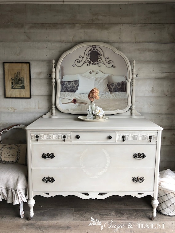 Dresser with Turned Legs on Casters, Ornate Hardware, Scrollwork Accent.