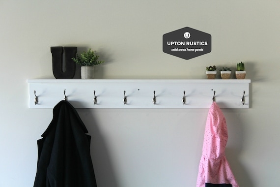 Modern Farmhouse Wall Coat Rack Shelf with Eight Silver-Toned Hooks.