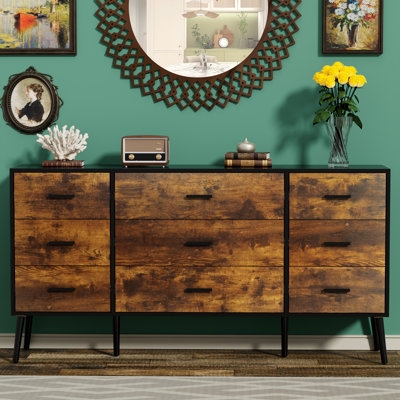 Rustic Wood Chest Against Teal Wall with Tapered Legs