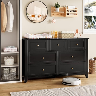 Seven-Drawer Dresser with Gold Knobs Styled as Nursery Changing Station