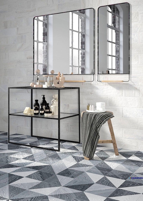 Bathroom Design: Geometric Tile Floor, Black Metal Console, Brick Wall