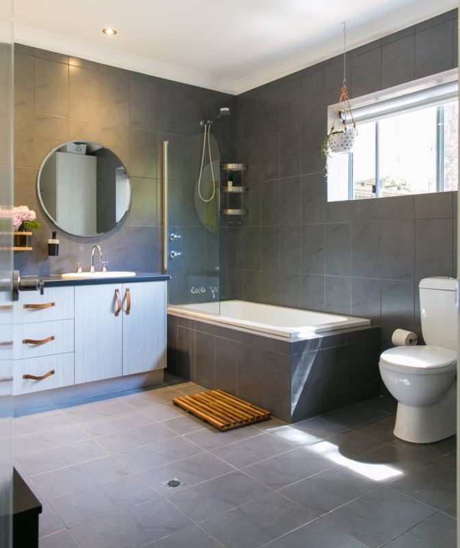 Bathroom Design with Matching Dark Gray Floor and Wall Tile