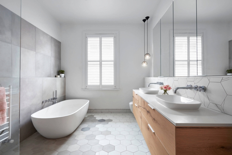 Bathroom Design: Wood Double Vanity, Hexagonal Floor Tiles, Freestanding Tub