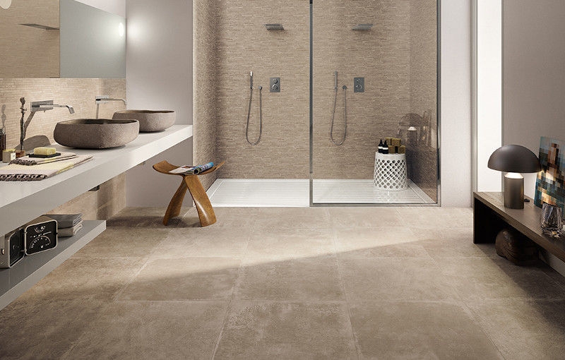 Bathroom Layout featuring Stone Vessel Sinks and Double Shower