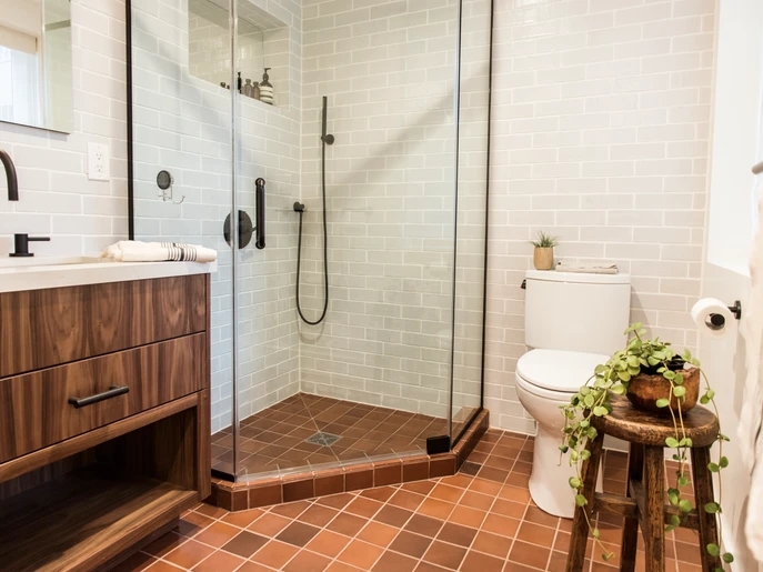 Bathroom Scene: Matte Terracotta Floor With Glossy Blue Subway Tile