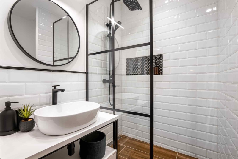 Bathroom with Black Framed Shower Screen and Beveled Subway Tiles