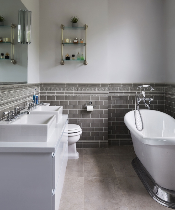 Bathroom with Decorative Border Tile Gray Subway Bridge Faucets