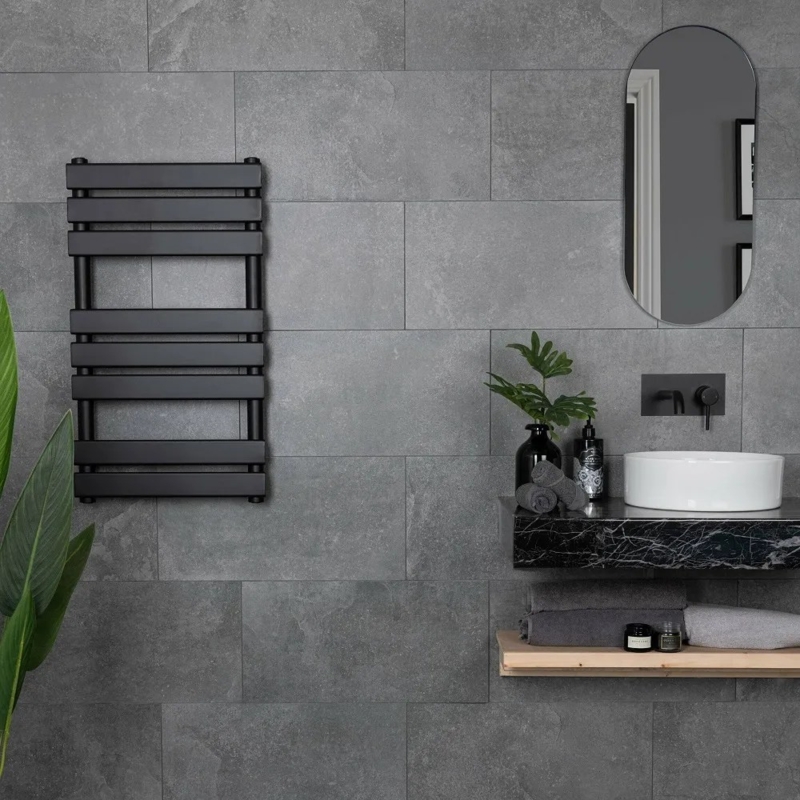 Bathroom with Stone Textured Walls Matte Black Fixtures Grey
