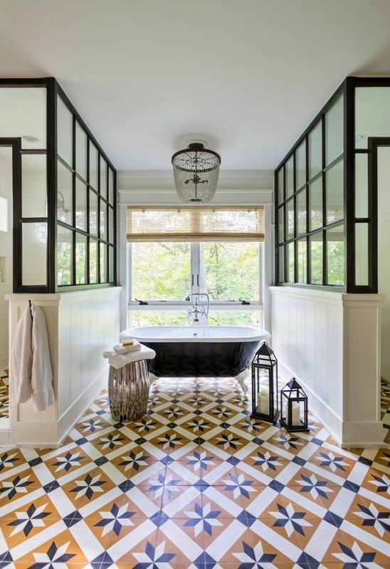Bold Geometric Bathroom Floor Tiles with Black Grid Glass Partitions