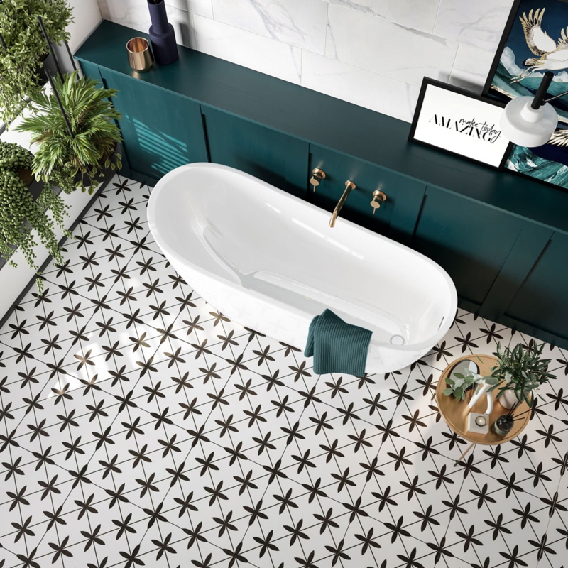 Bold Starburst Bathroom Floor Tile with Deep Teal Cabinetry and Gold