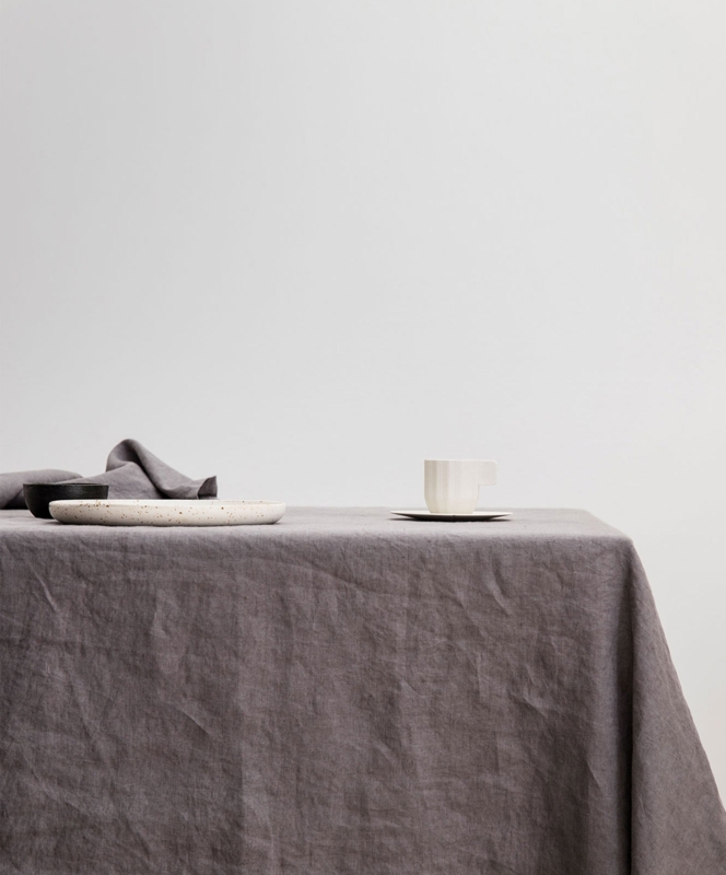 Charcoal Gray Linen Tablecloth with Textured Weave for Minimalist Setting.